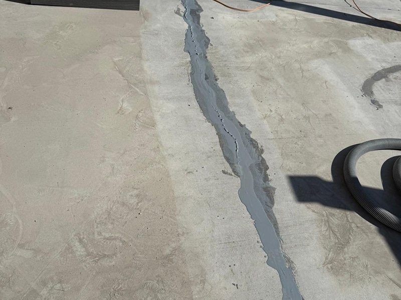 Concrete crack repair in progress on a driveway in Salem, Indiana by Sullivan's Concrete Coatings