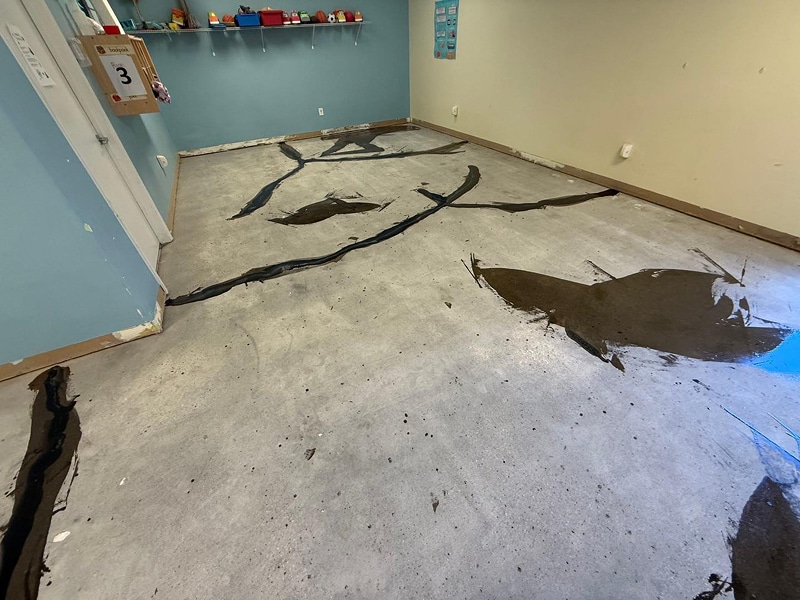 Severely cracked interior concrete floor before repair in Salem, Indiana by Sullivan's Concrete Coatings