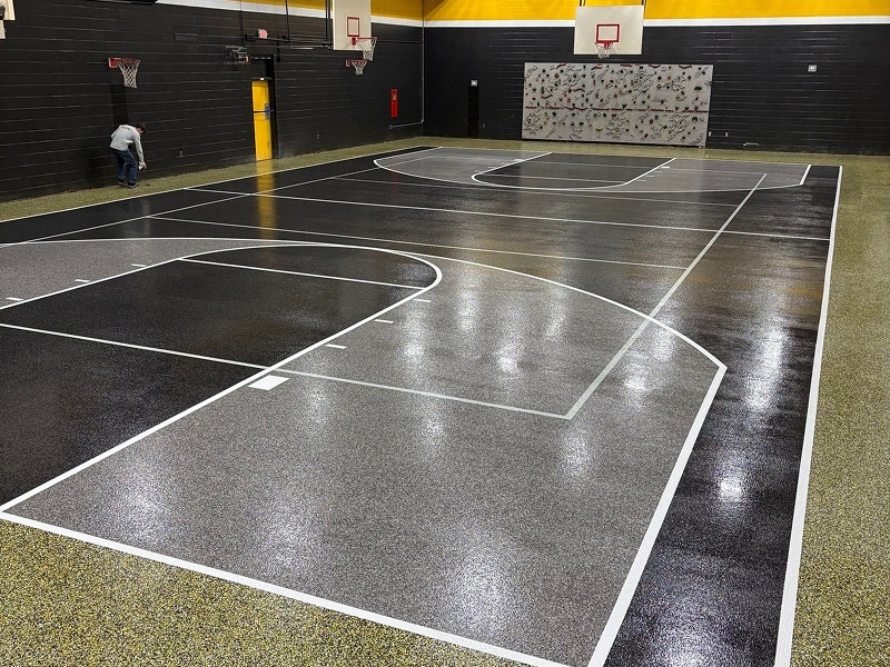 Coated concrete flooring on an indoor basketball court in Louisville, Kentucky by Sullivan's Concrete Coatings