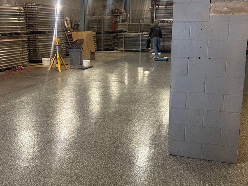 Flake concrete warehouse floor coating in New Albany, Indiana by Sullivan's Concrete Coatings