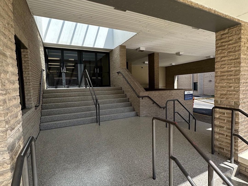 Flake concrete coating on commercial entrance stairs in Louisville, Kentucky by Sullivan's Concrete Coatings
