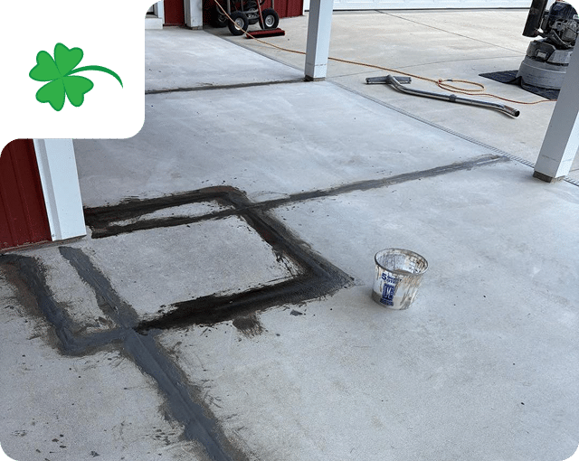 Concrete crack repair being performed before a flake floor coating by Sullivan's Concrete Coatings in Southern Indiana